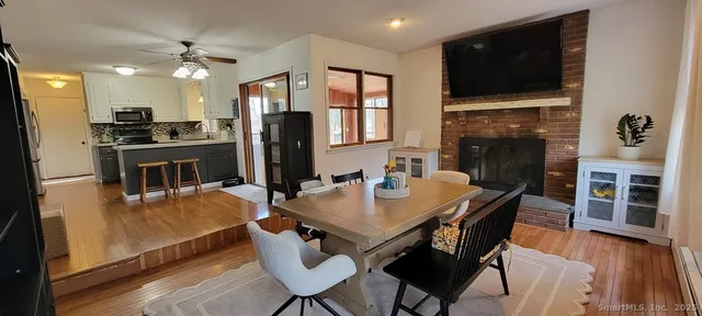 a view of a dining room with furniture window and wooden floor