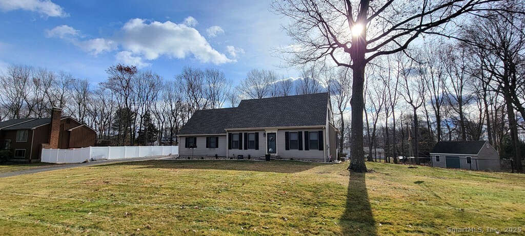 48 Saddle Road Wolcott, CT 06716 - Photo 2 of 40 a swimming pool with trees in the background