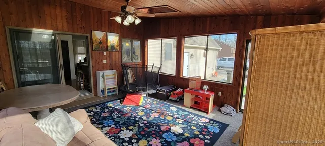 a room with lots of furniture and a chandelier
