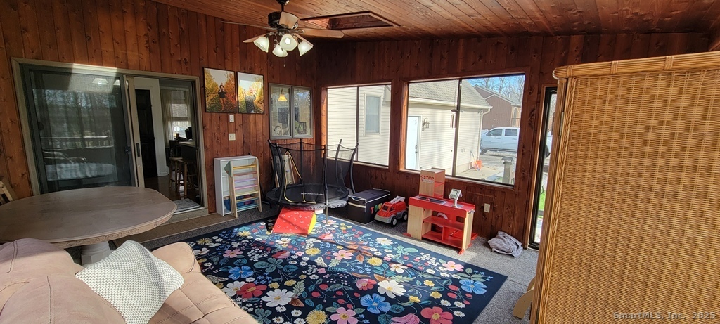 48 Saddle Road Wolcott, CT 06716 - Photo 21 of 40 a room with lots of furniture and a chandelier