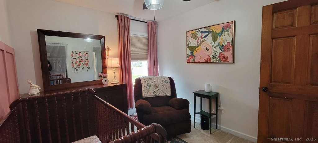 48 Saddle Road Wolcott, CT 06716 - Photo 31 of 40 a living room with furniture and a window
