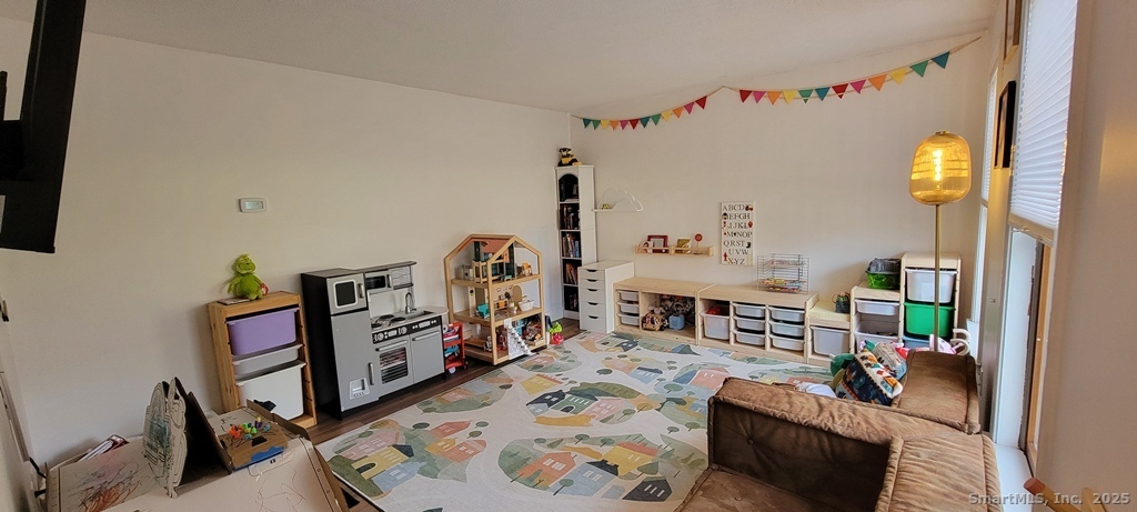 48 Saddle Road Wolcott, CT 06716 - Photo 5 of 40 a living room with furniture and a wooden floor