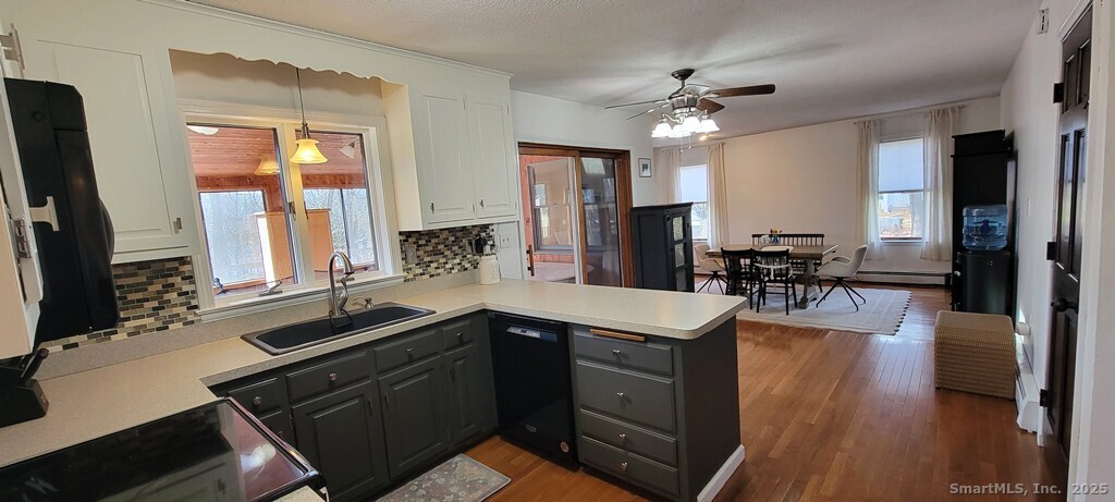 48 Saddle Road Wolcott, CT 06716 - Photo 9 of 40 a kitchen with a sink appliances and a counter top space