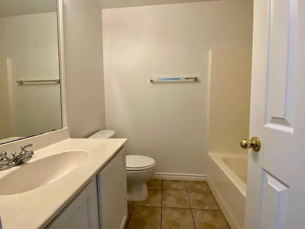 a bathroom with a sink and toilet