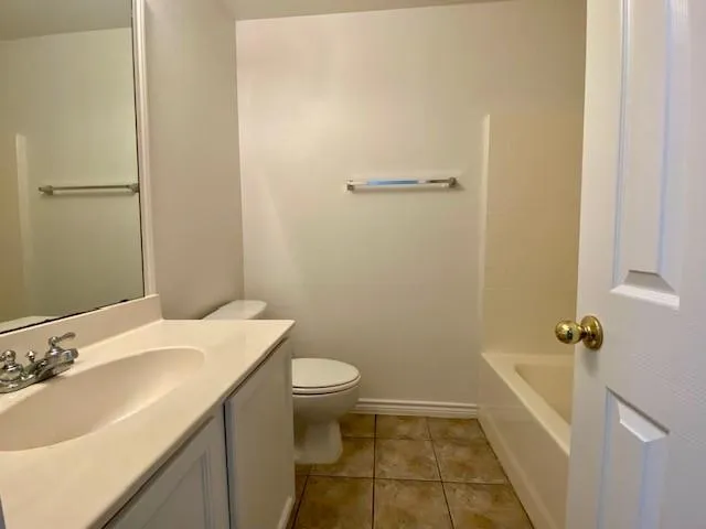 a bathroom with a sink and toilet