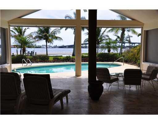 2391 Southwest Riverside Drive Palm City, FL 34990 - Photo 1 of 8 a view of an outdoor space with furniture and garden view