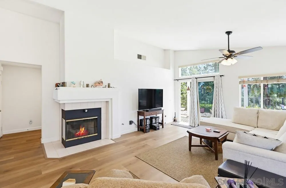 2501 Columbine Road Alpine, CA 91901 - Photo 6 of 44 a living room with furniture a fireplace and a flat screen tv