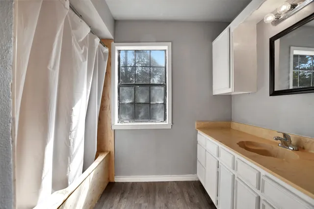 a bathroom with a sink and a bathtub