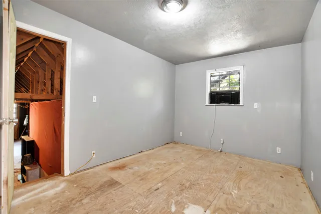 a view of empty room with a flat screen tv