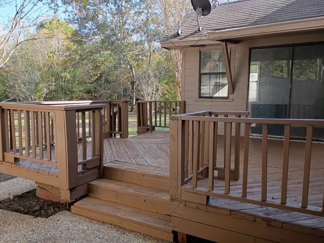 a view of a deck with barbeque grill wooden floor and fence