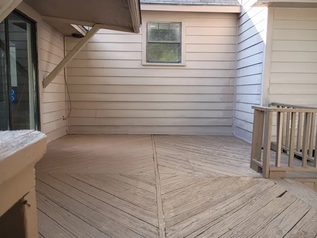 a view of a balcony with door