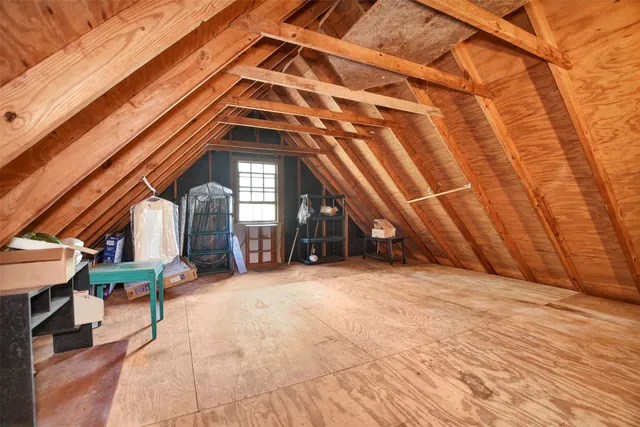 a view of an chairs and table on the wooden roof