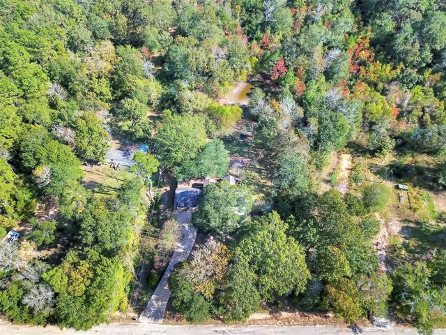 a view of a house with a tree