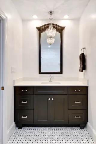 a bedroom with a bed and a lamp