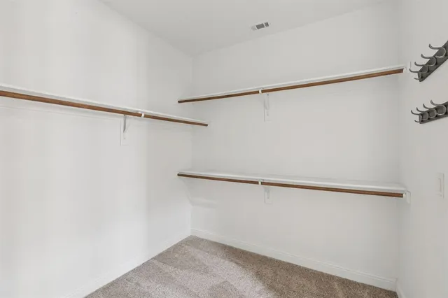 a view of a room with racks on the wall