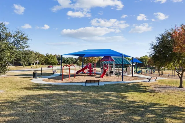 a view of a swimming pool with an outdoor seating