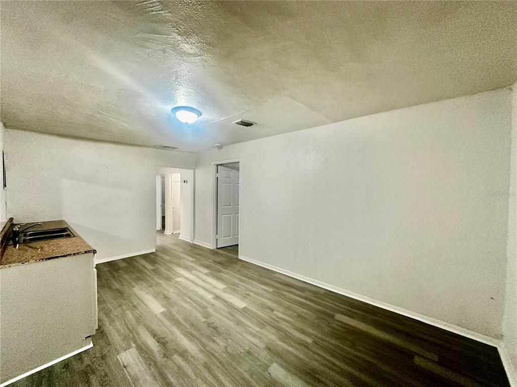 1907 Rio Grande Avenue Orlando, FL 32805 - Photo 5 of 17 a view of empty room with wooden floor