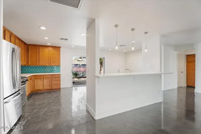 a view of kitchen and windows