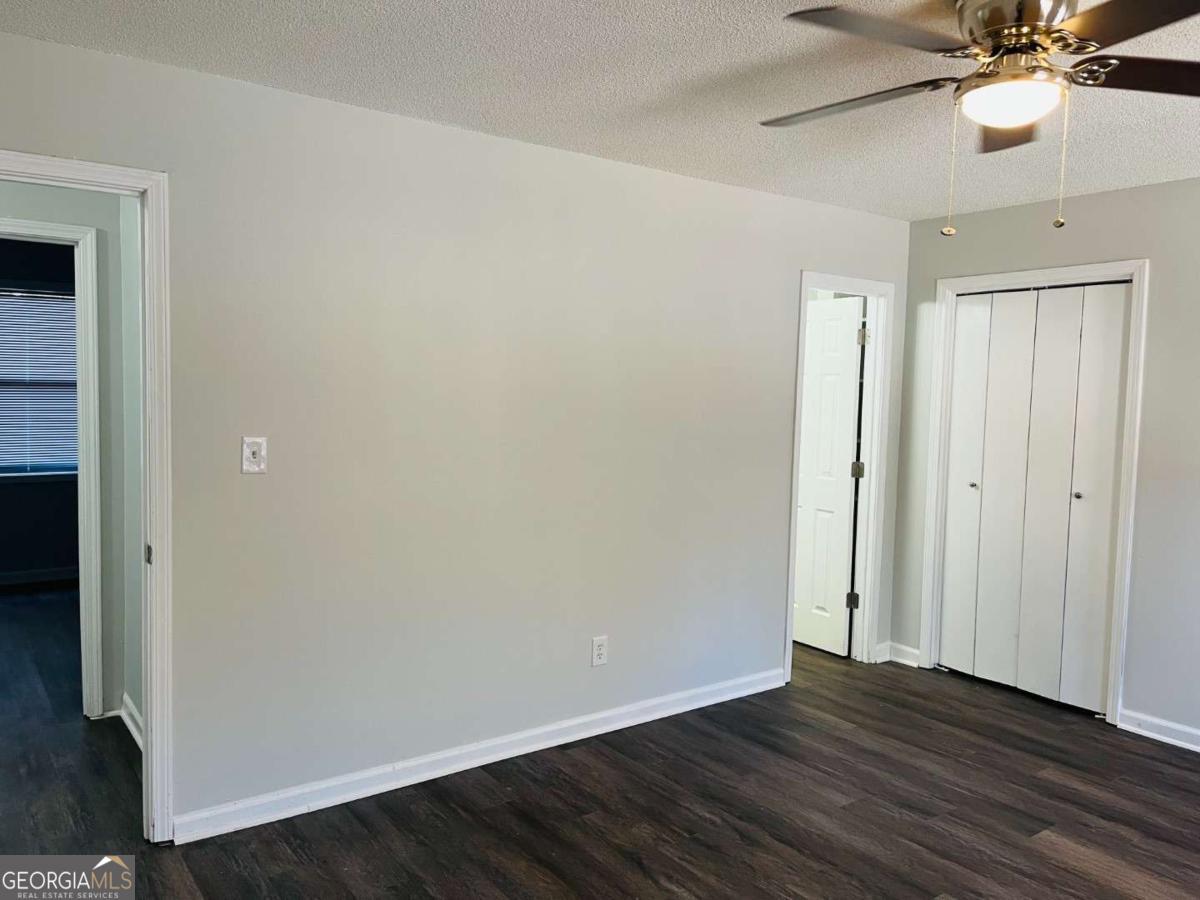 5614 Windwood Road, Unit 5614 Atlanta, GA 30349 - Photo 21 of 26 a view of an empty room with wooden floor