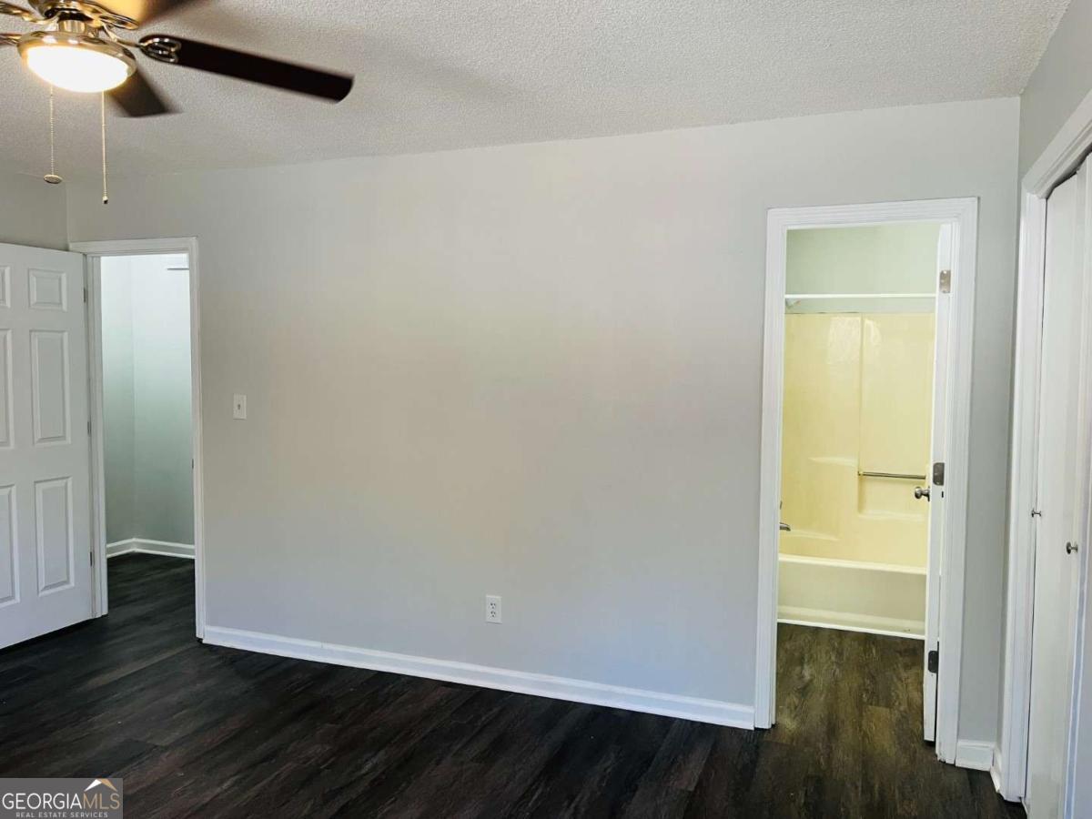5614 Windwood Road, Unit 5614 Atlanta, GA 30349 - Photo 24 of 26 wooden floor in an empty room