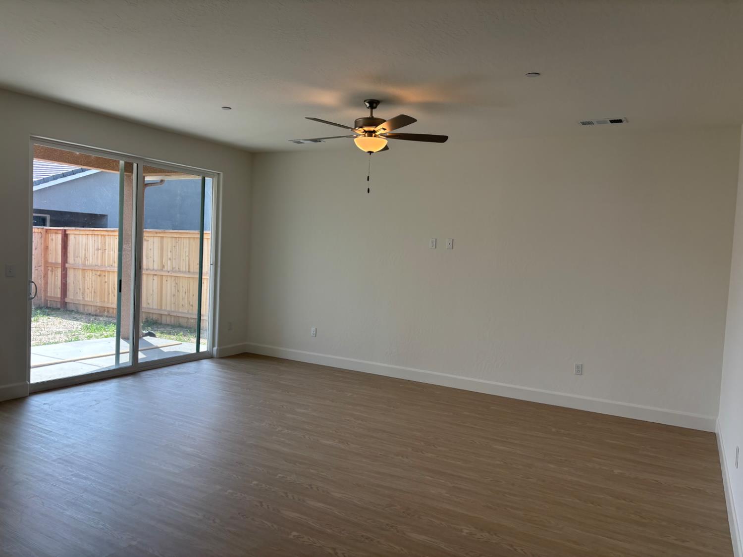 3808 Via Capitola Madera, CA 93637 - Photo 3 of 8 a view of room with wooden floor and fan