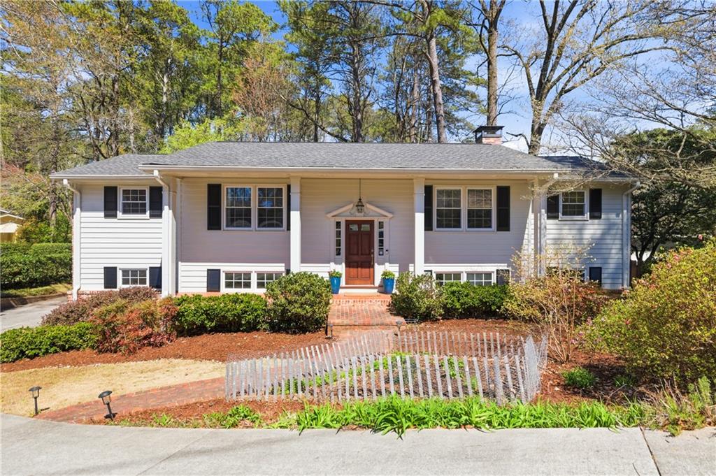 2864 Briarlake Road Northeast Atlanta, GA 30345 - Photo 1 of 77 a front view of a house with a garden