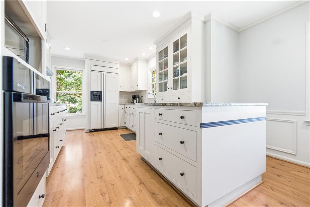 2864 Briarlake Road Northeast Atlanta, GA 30345 - Photo 14 of 77 a kitchen with stainless steel appliances a lot of counter top space and wooden floor