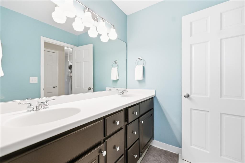 2864 Briarlake Road Northeast Atlanta, GA 30345 - Photo 22 of 77 a bathroom with a sink double vanity and a mirror