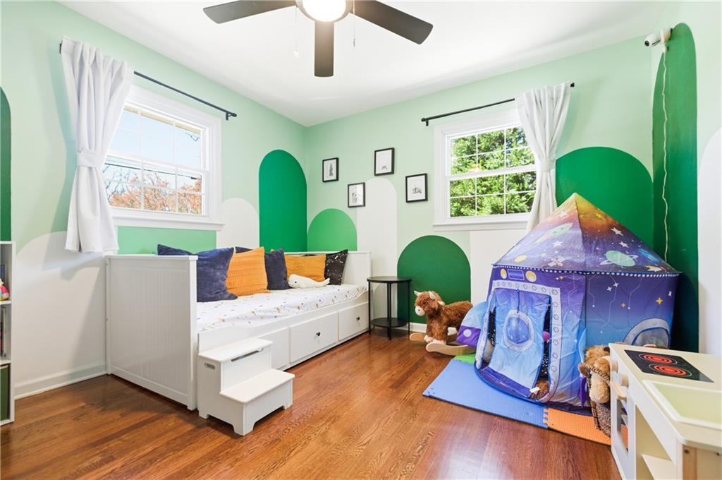 2864 Briarlake Road Northeast Atlanta, GA 30345 - Photo 25 of 77 a living room with fireplace furniture and a wooden floor