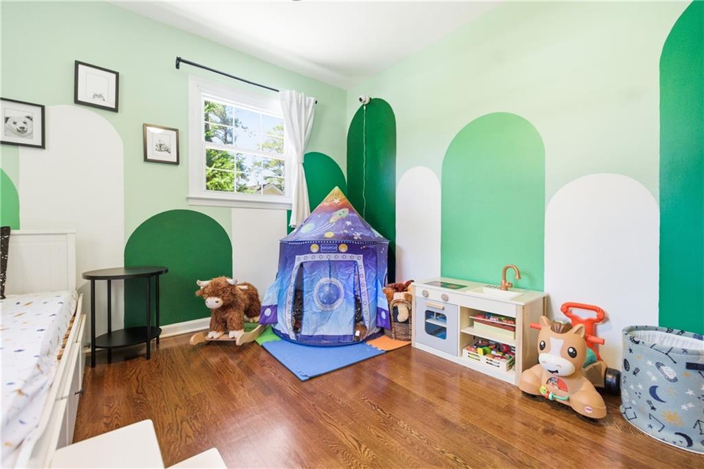 2864 Briarlake Road Northeast Atlanta, GA 30345 - Photo 26 of 77 a living room with furniture and a wooden floor