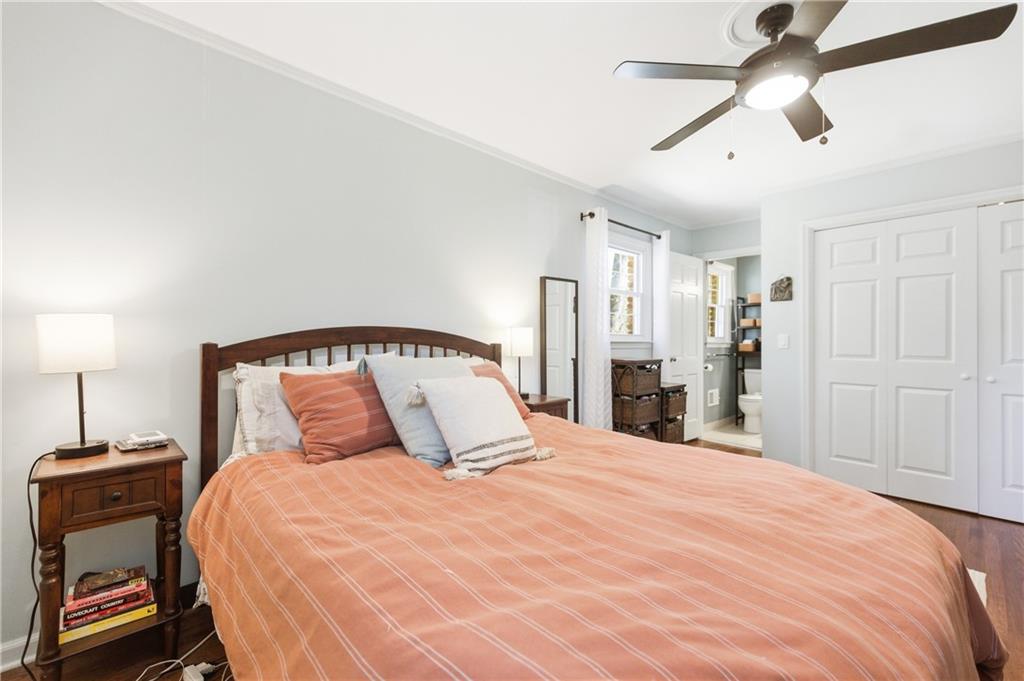 2864 Briarlake Road Northeast Atlanta, GA 30345 - Photo 31 of 77 a bedroom with a large bed and a chandelier