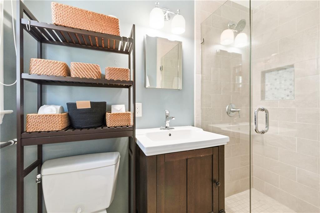 2864 Briarlake Road Northeast Atlanta, GA 30345 - Photo 34 of 77 a bathroom with a sink a toilet and a mirror