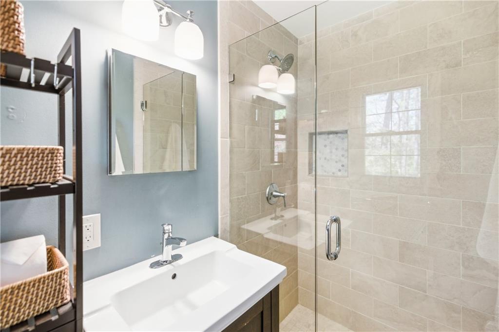 2864 Briarlake Road Northeast Atlanta, GA 30345 - Photo 36 of 77 a bathroom with a sink shower and a mirror