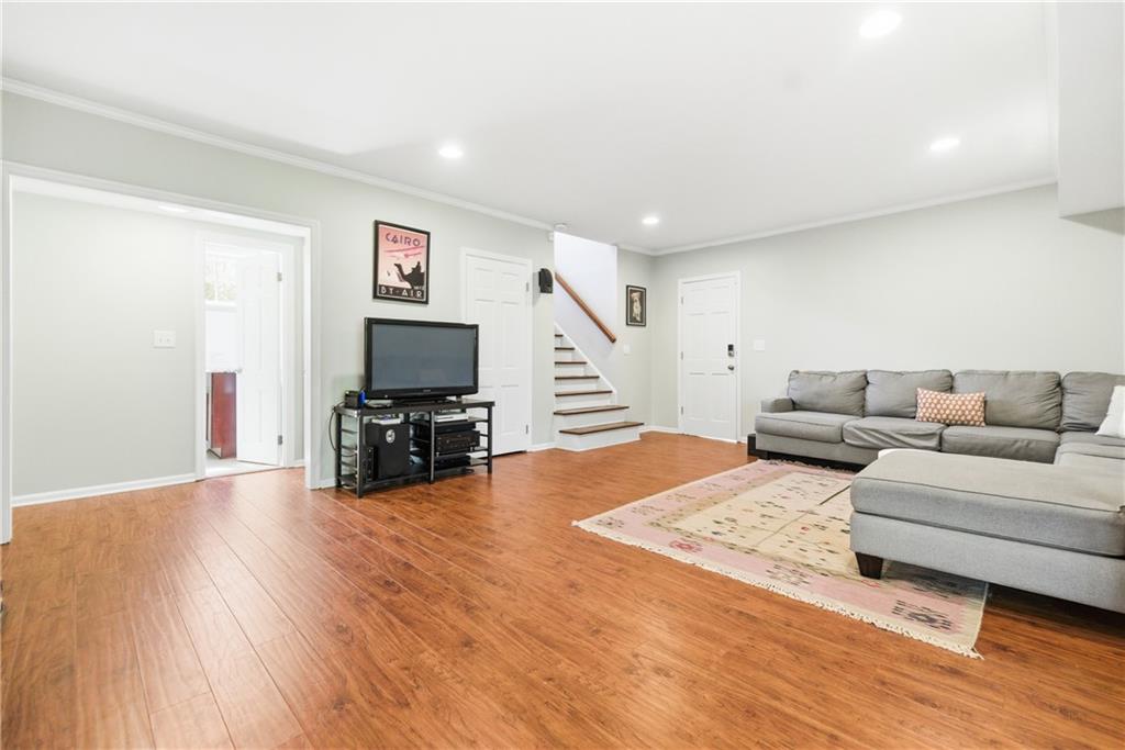 2864 Briarlake Road Northeast Atlanta, GA 30345 - Photo 40 of 77 a living room with furniture and a flat screen tv