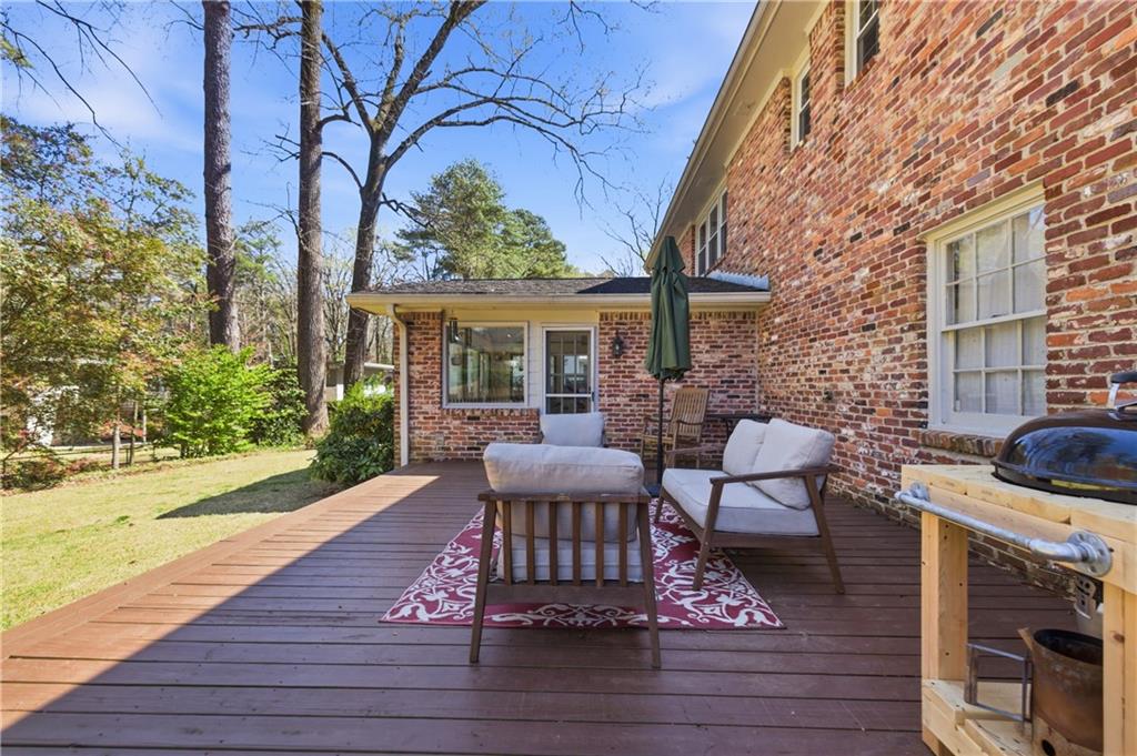 2864 Briarlake Road Northeast Atlanta, GA 30345 - Photo 58 of 77 a view of a house with backyard sitting area and wooden floor