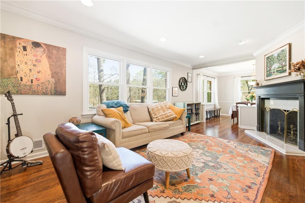 2864 Briarlake Road Northeast Atlanta, GA 30345 - Photo 6 of 77 a living room with furniture a fireplace and a large window