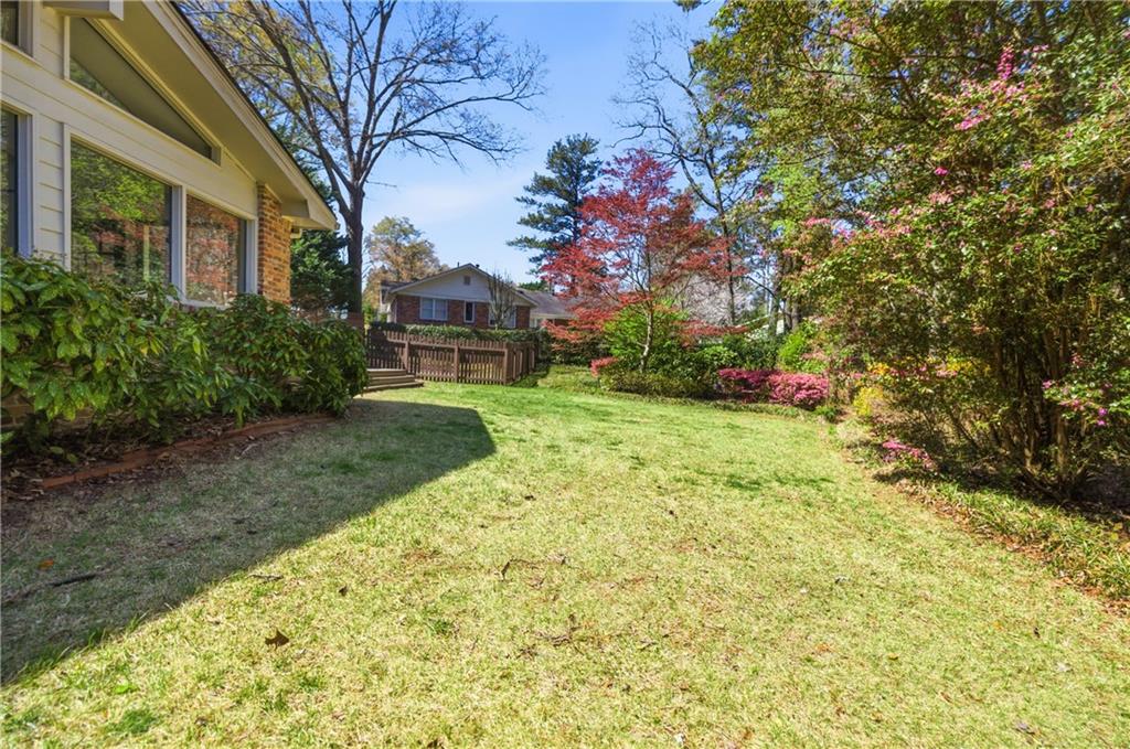 2864 Briarlake Road Northeast Atlanta, GA 30345 - Photo 64 of 77 a view of a backyard with plants and large trees