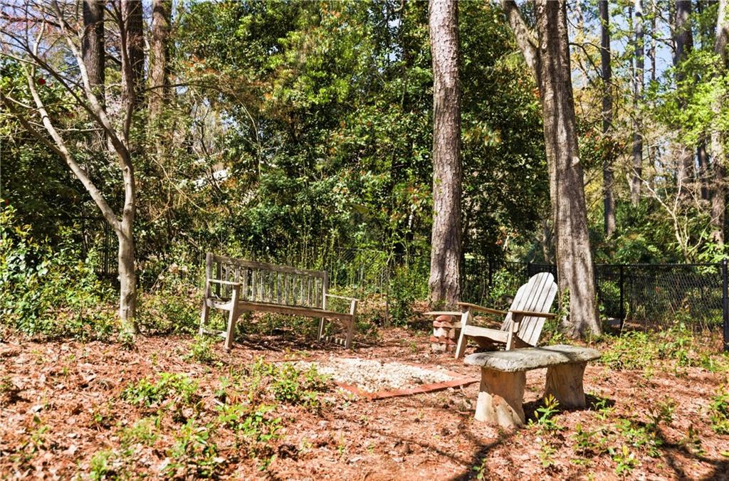 2864 Briarlake Road Northeast Atlanta, GA 30345 - Photo 71 of 77 a view of backyard with table and chairs and a large tree