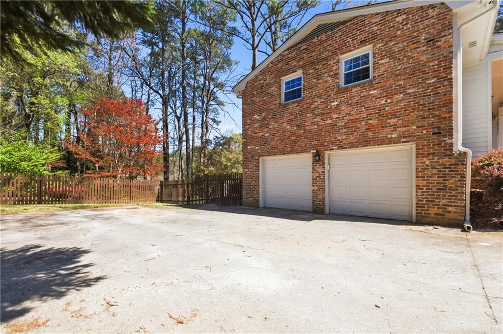 2864 Briarlake Road Northeast Atlanta, GA 30345 - Photo 76 of 77 a front view of a house with a yard