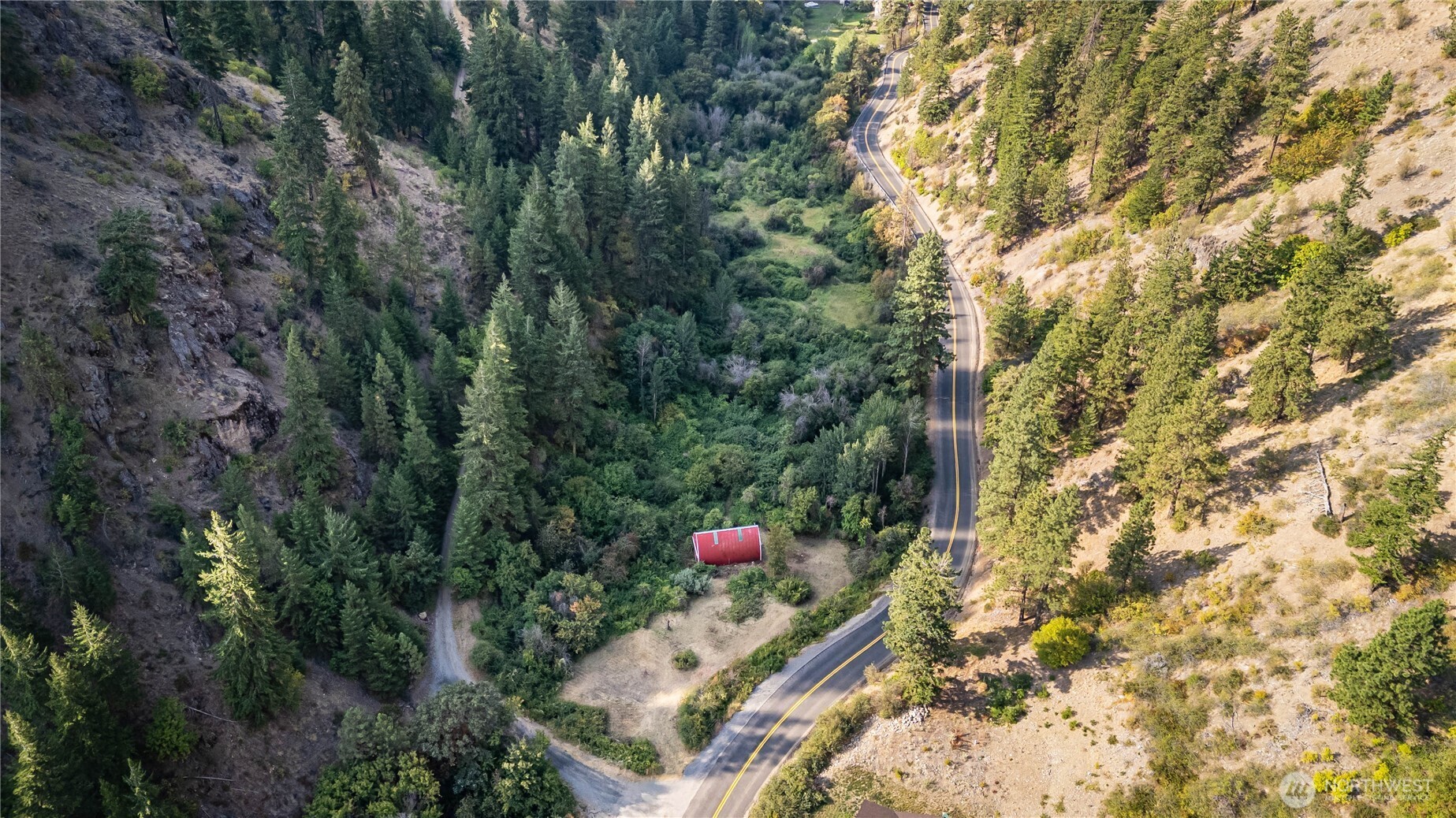 8979 Olalla Canyon Road Cashmere, WA 98815 - Photo 4 of 18 a aerial view of a house with a yard and covered in snow
