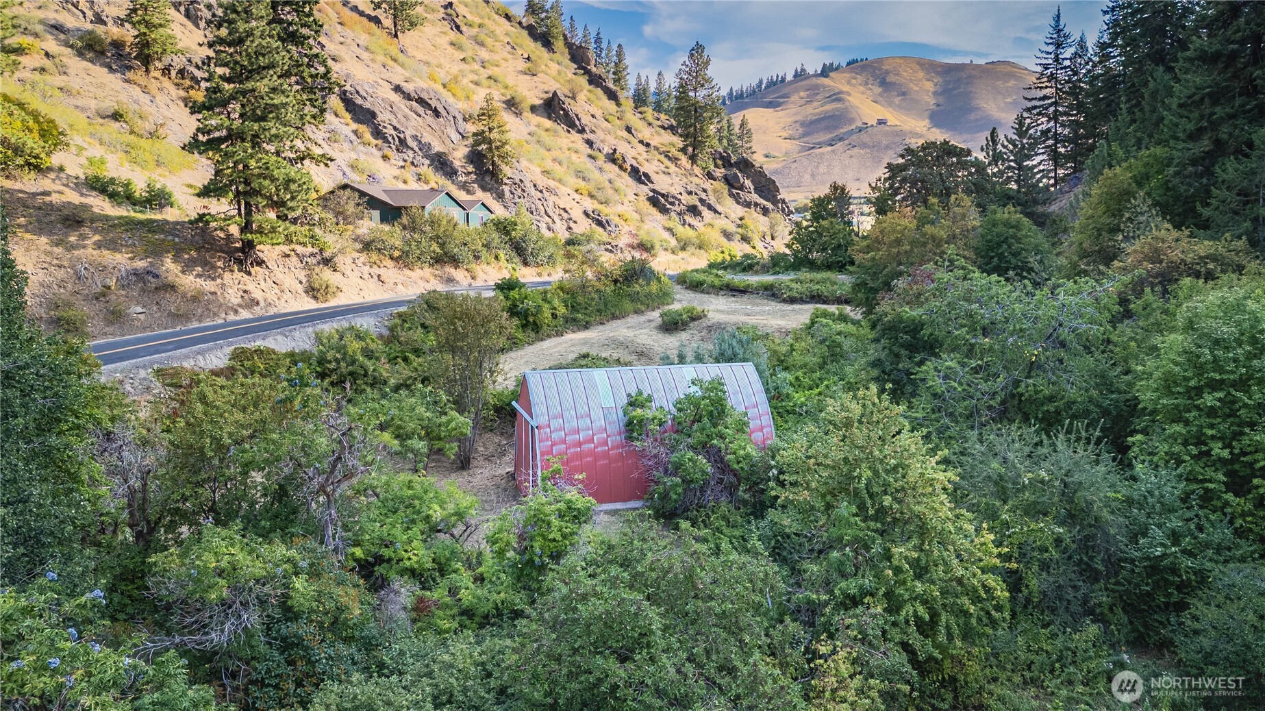 8979 Olalla Canyon Road Cashmere, WA 98815 - Photo 7 of 18 an aerial view of a house by greenery space