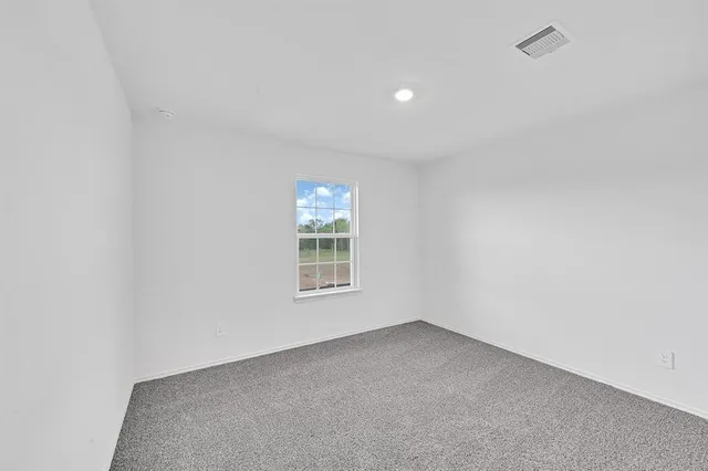 a view of a swimming pool with a yard