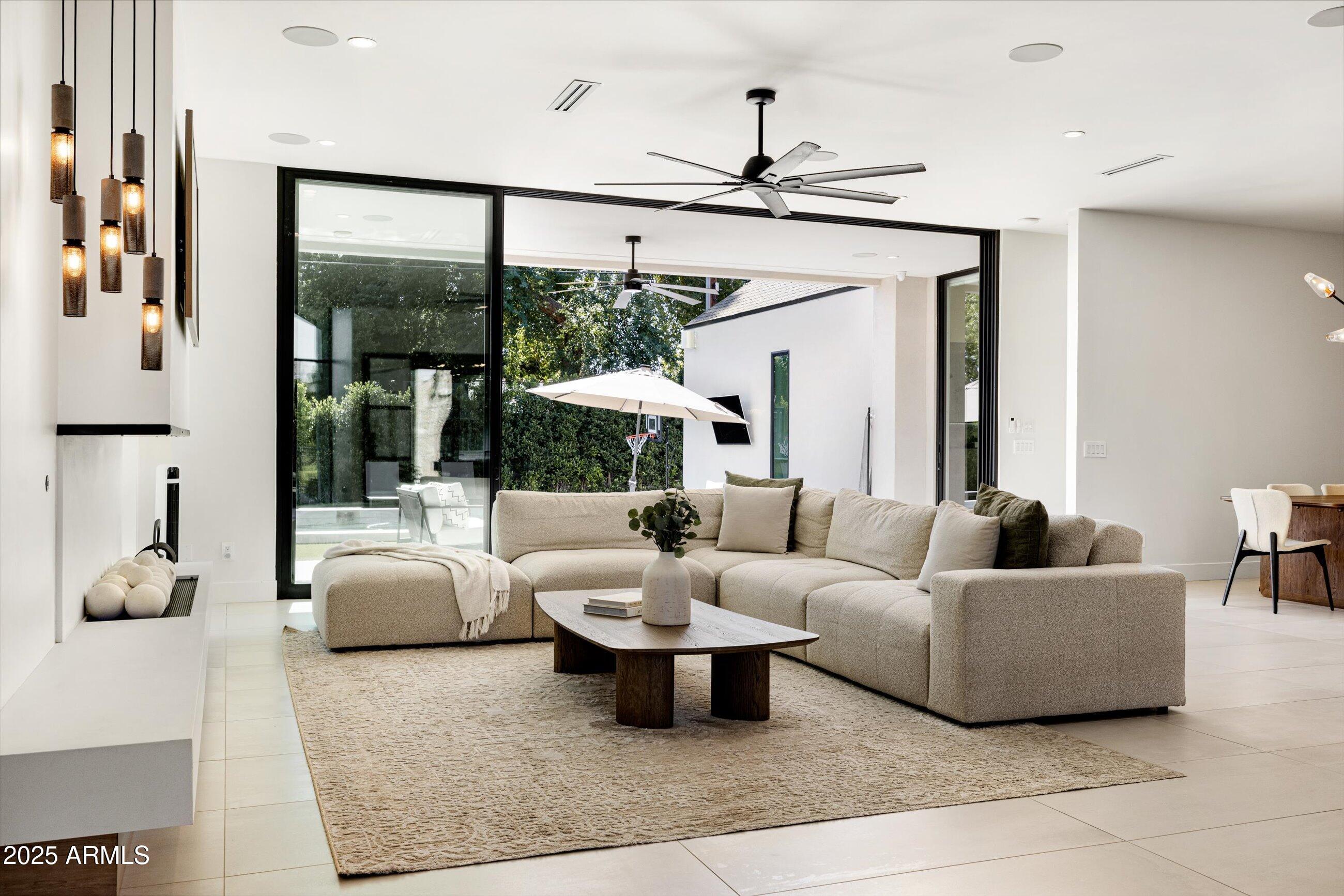 3721 East Piccadilly Road Phoenix, AZ 85018 - Photo 10 of 54 a living room with furniture and a large window