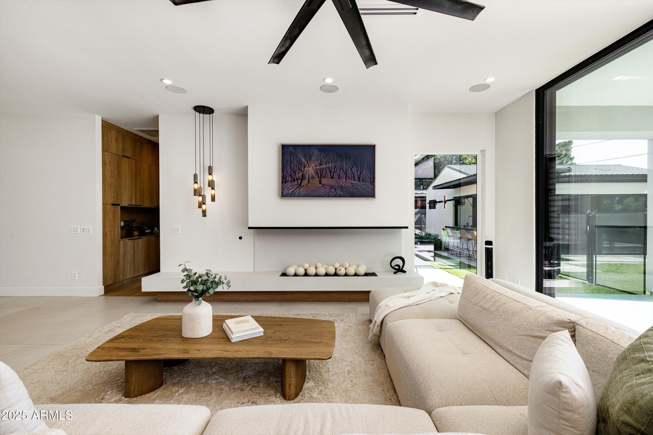 3721 East Piccadilly Road Phoenix, AZ 85018 - Photo 11 of 54 a living room with furniture and a large window