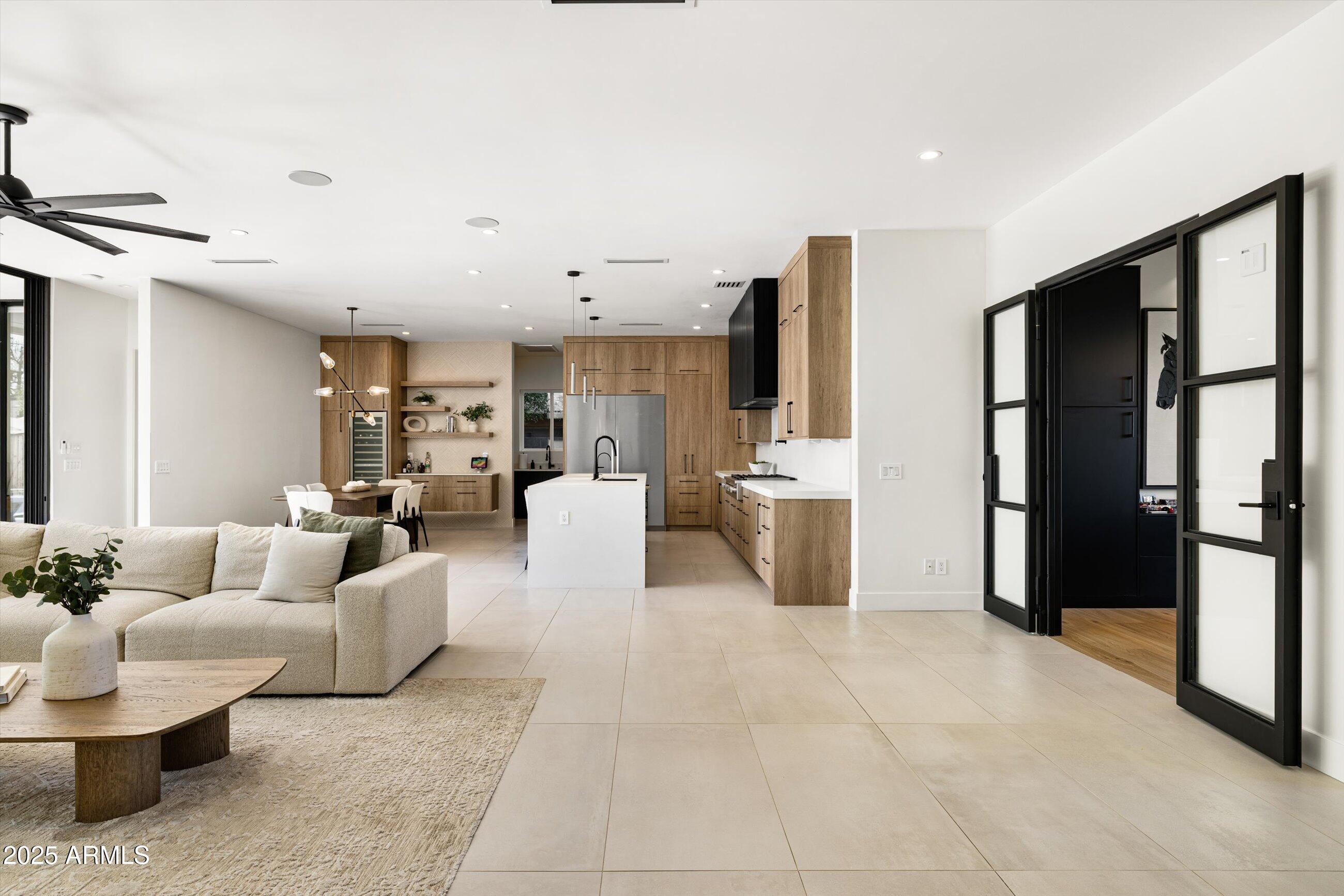 3721 East Piccadilly Road Phoenix, AZ 85018 - Photo 13 of 54 a living room with furniture a refrigerator and kitchen view