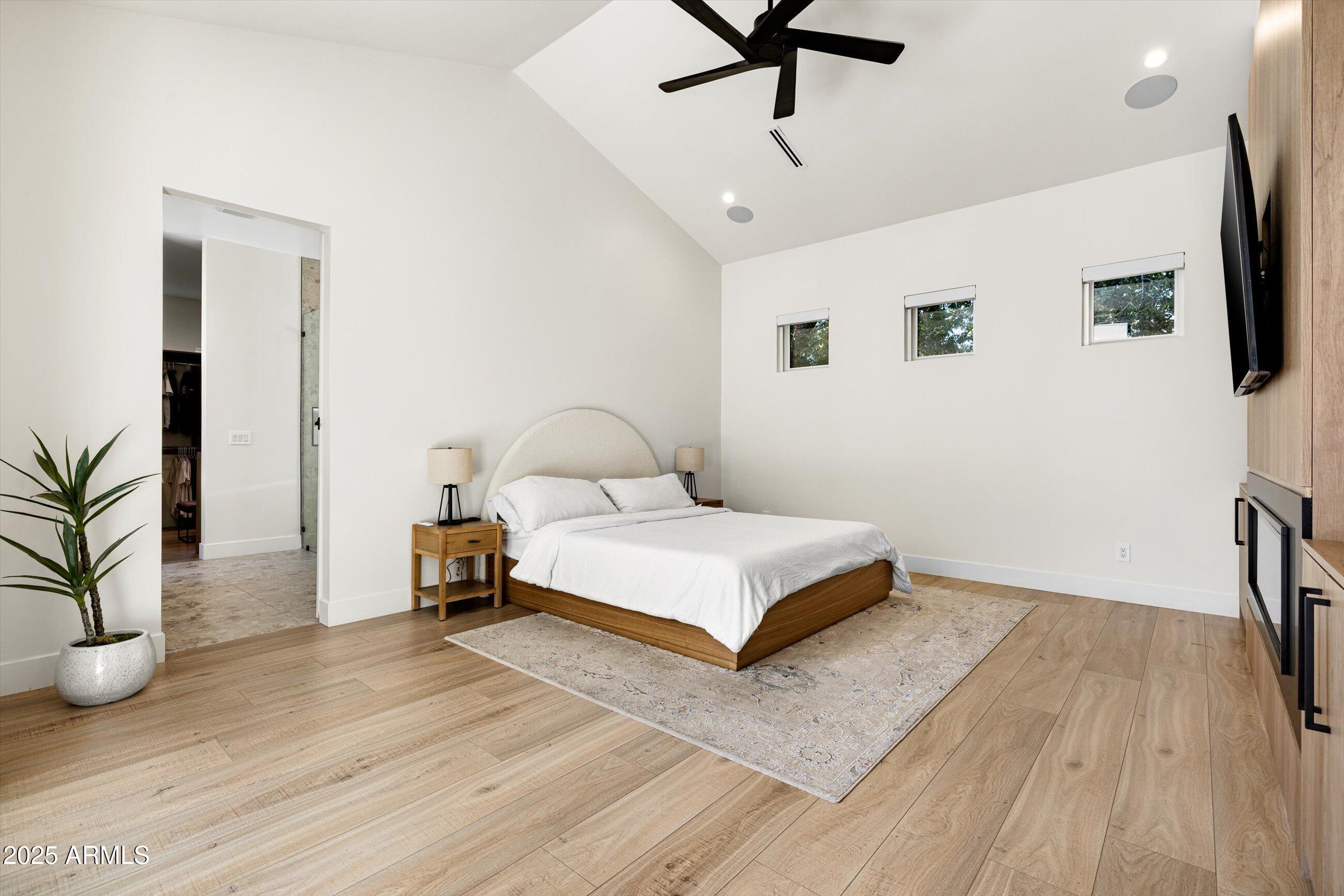 3721 East Piccadilly Road Phoenix, AZ 85018 - Photo 22 of 54 a bedroom with a bed and a flat screen tv