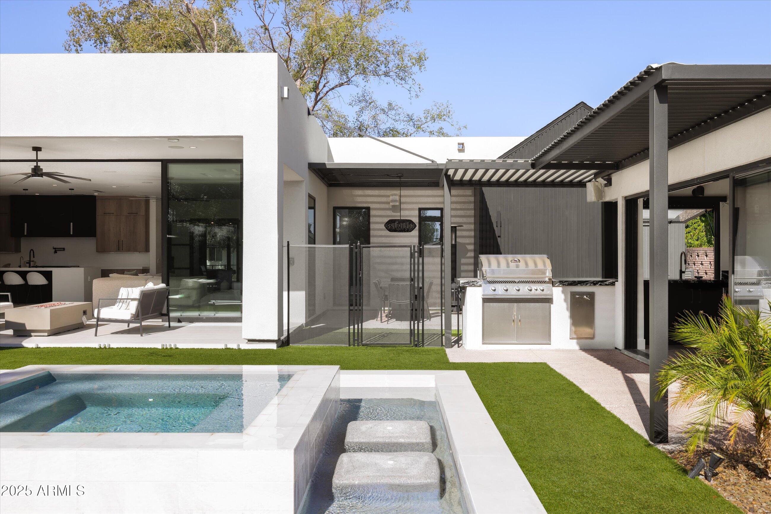 3721 East Piccadilly Road Phoenix, AZ 85018 - Photo 38 of 54 a view of a house with backyard swimming pool and sitting area