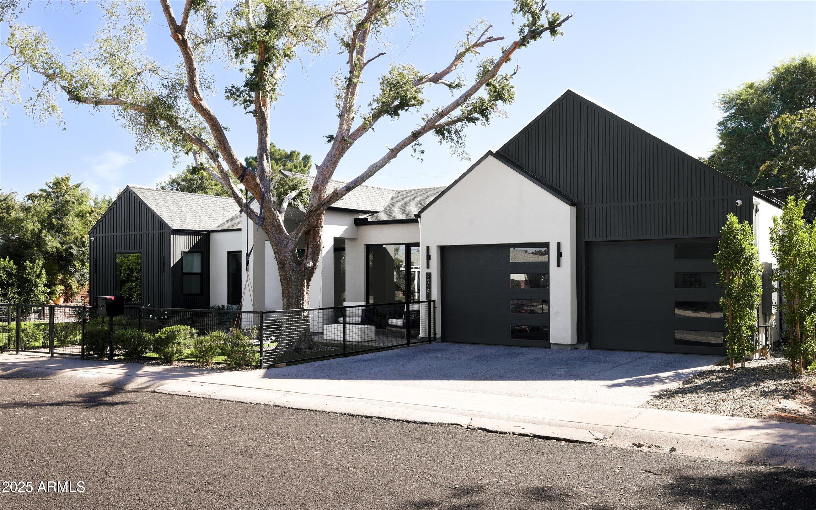 3721 East Piccadilly Road Phoenix, AZ 85018 - Photo 3 of 54 a front view of a house with a yard and garage