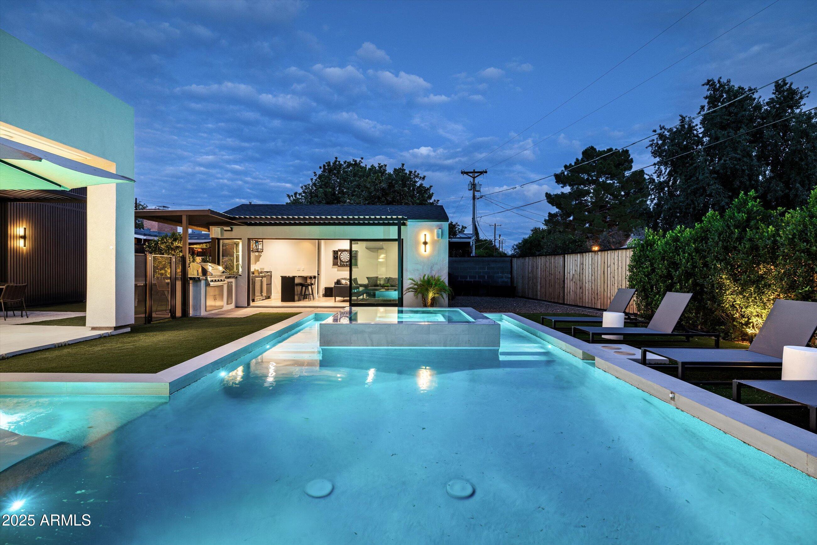 3721 East Piccadilly Road Phoenix, AZ 85018 - Photo 41 of 54 a view of a house with swimming pool and sitting area