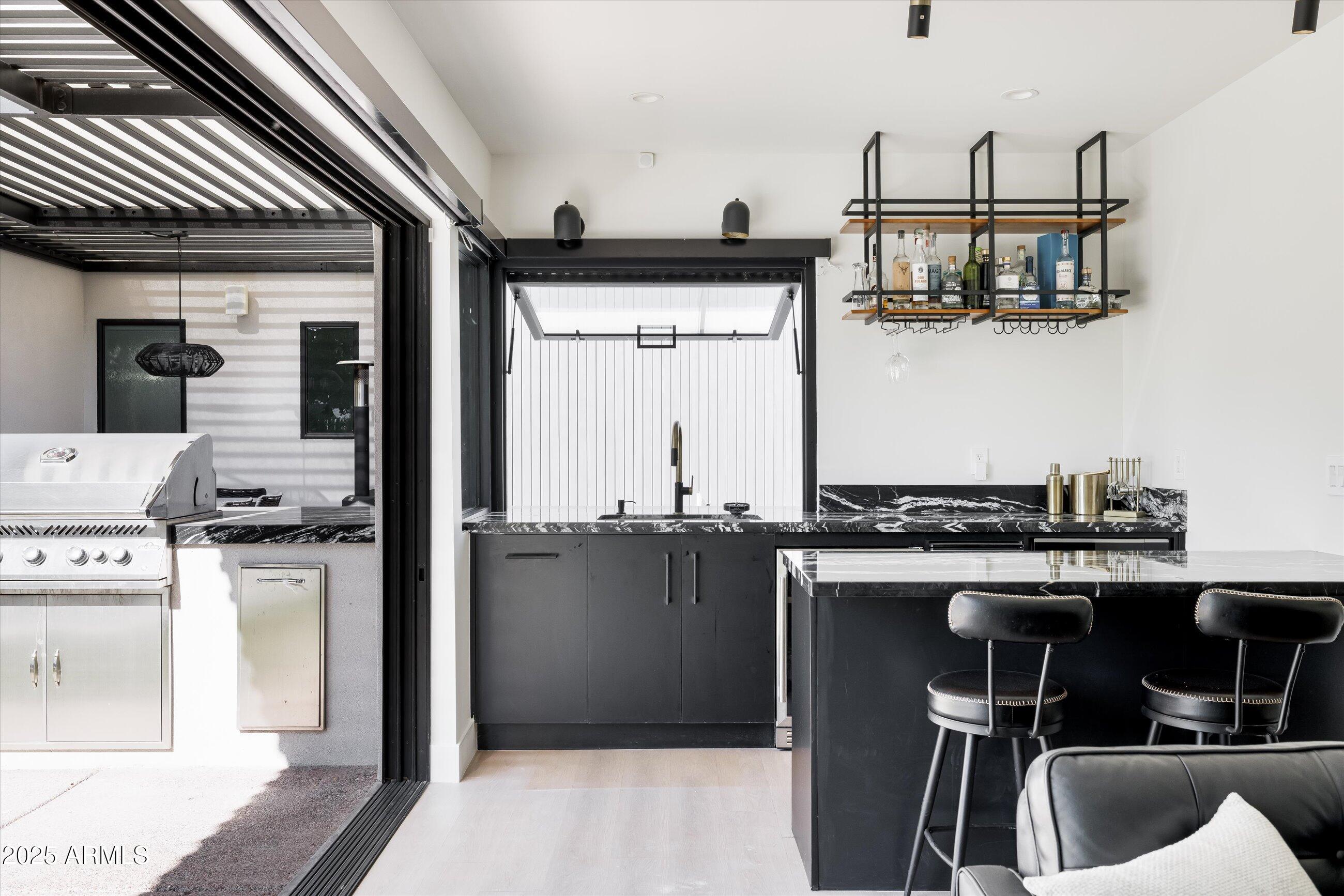 3721 East Piccadilly Road Phoenix, AZ 85018 - Photo 43 of 54 a kitchen with stainless steel appliances granite countertop a sink stove and refrigerator